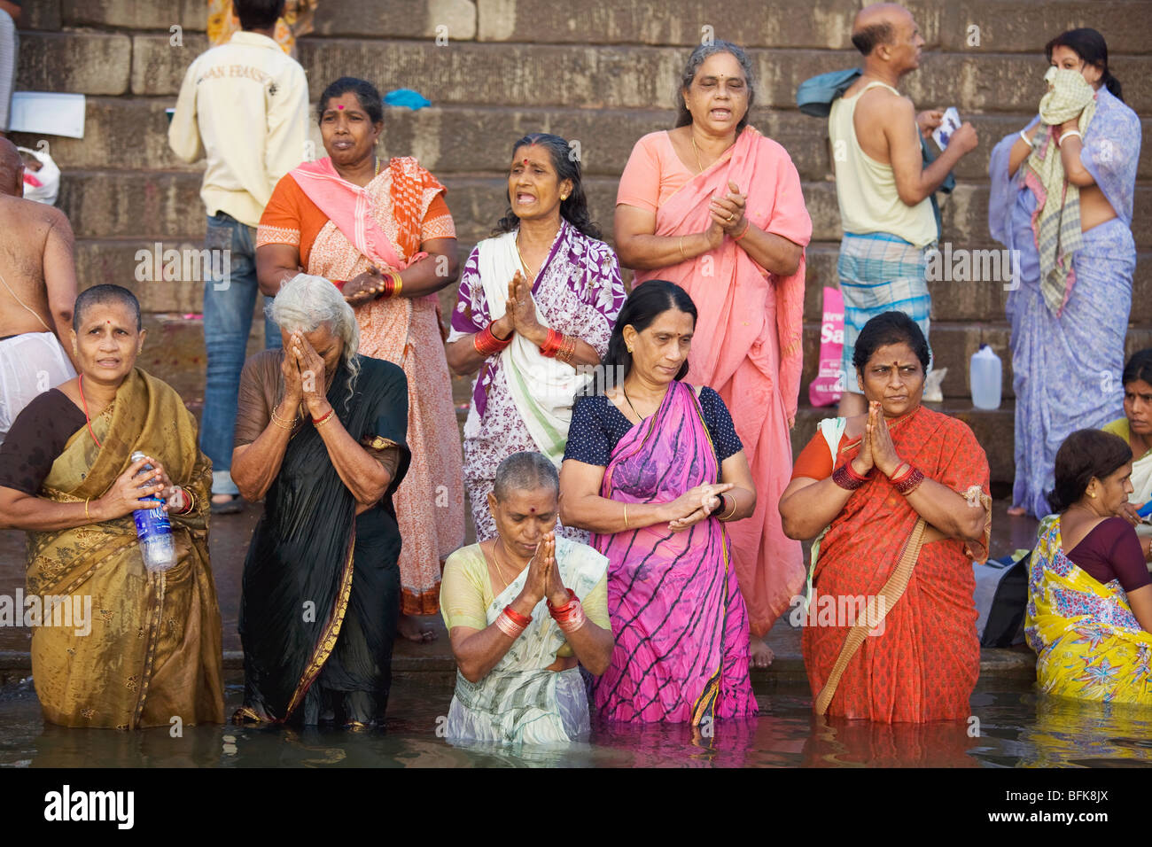 People come to pray and bathe in the holy waters of the Ganges River at Varanasi, India Stock Photo