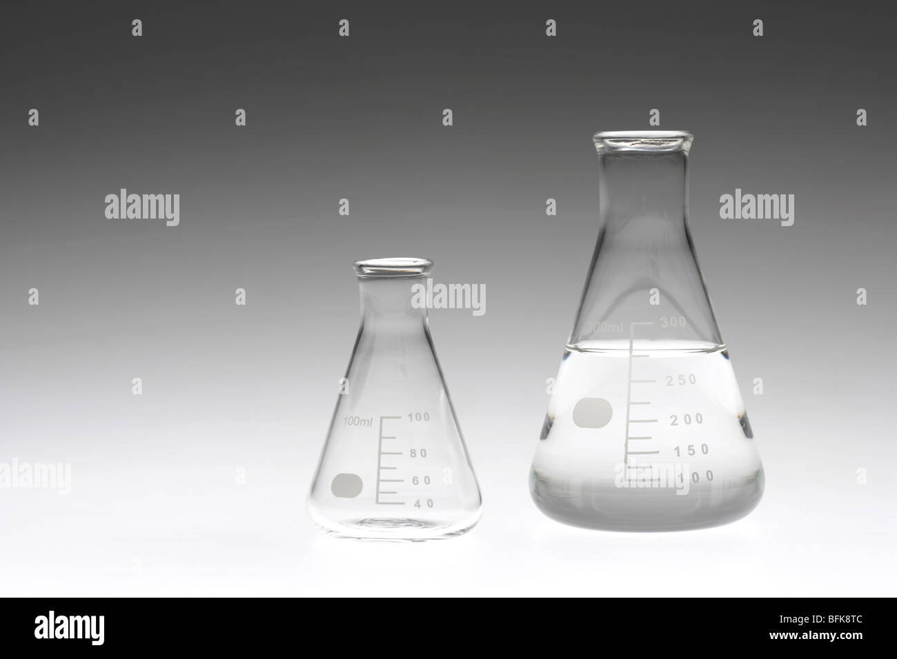 Two flasks colored background Stock Photo Alamy