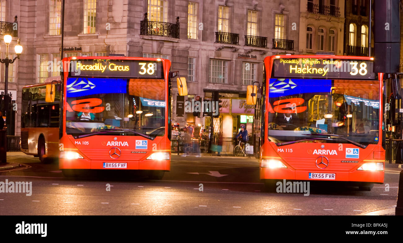 London Buses in Piccadilly Circus at Night Stock Photo