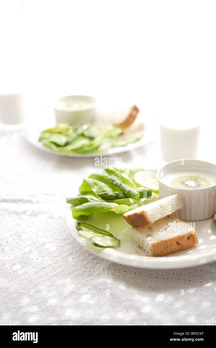 Plates of bread and salad Stock Photo Alamy
