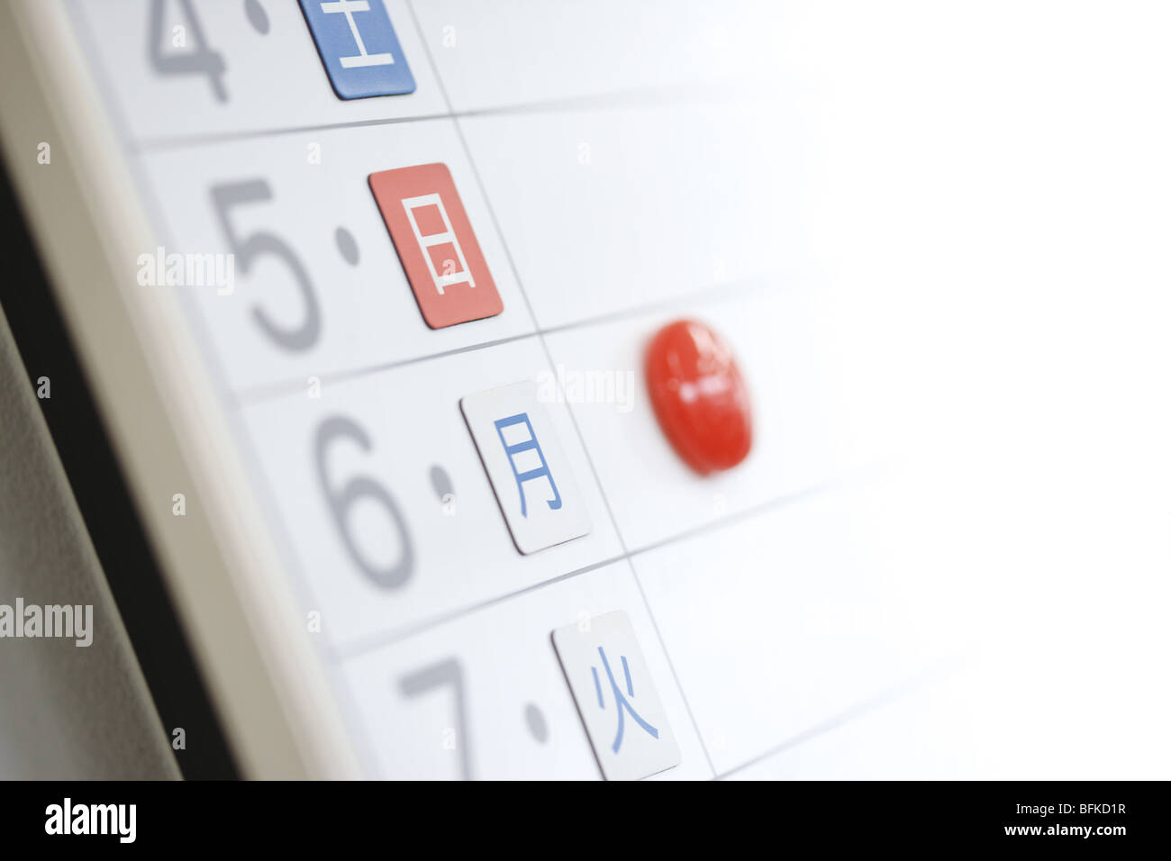Close up of whiteboard with date and magnets Stock Photo