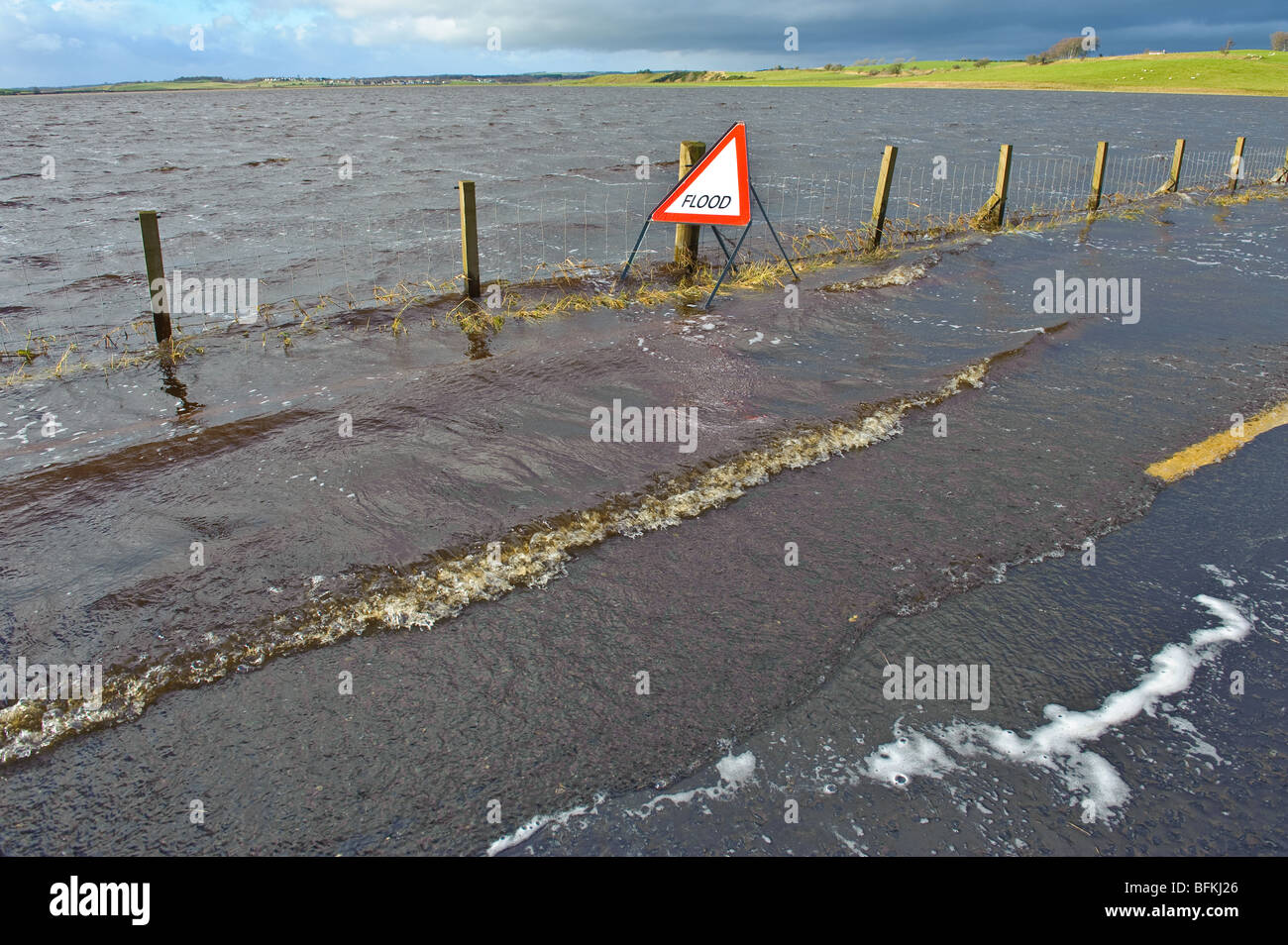 Flood warning sign on flooded road in South Lanarkshire Scotland Stock Photo