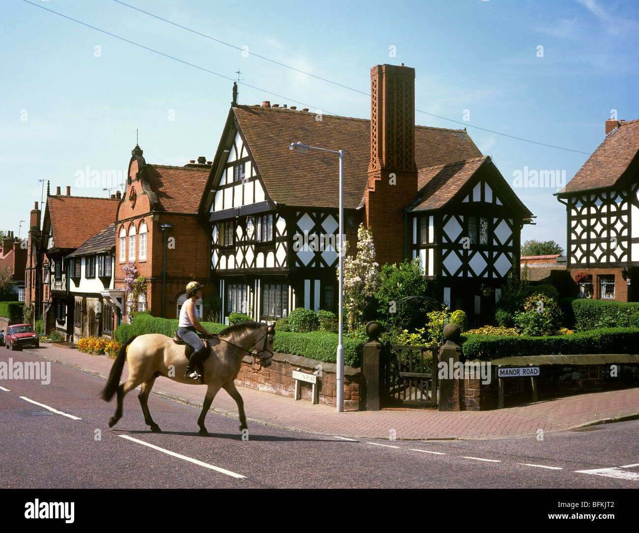 UK, England, Wirral, Thornton Hough, Neston Road, woman riding horse