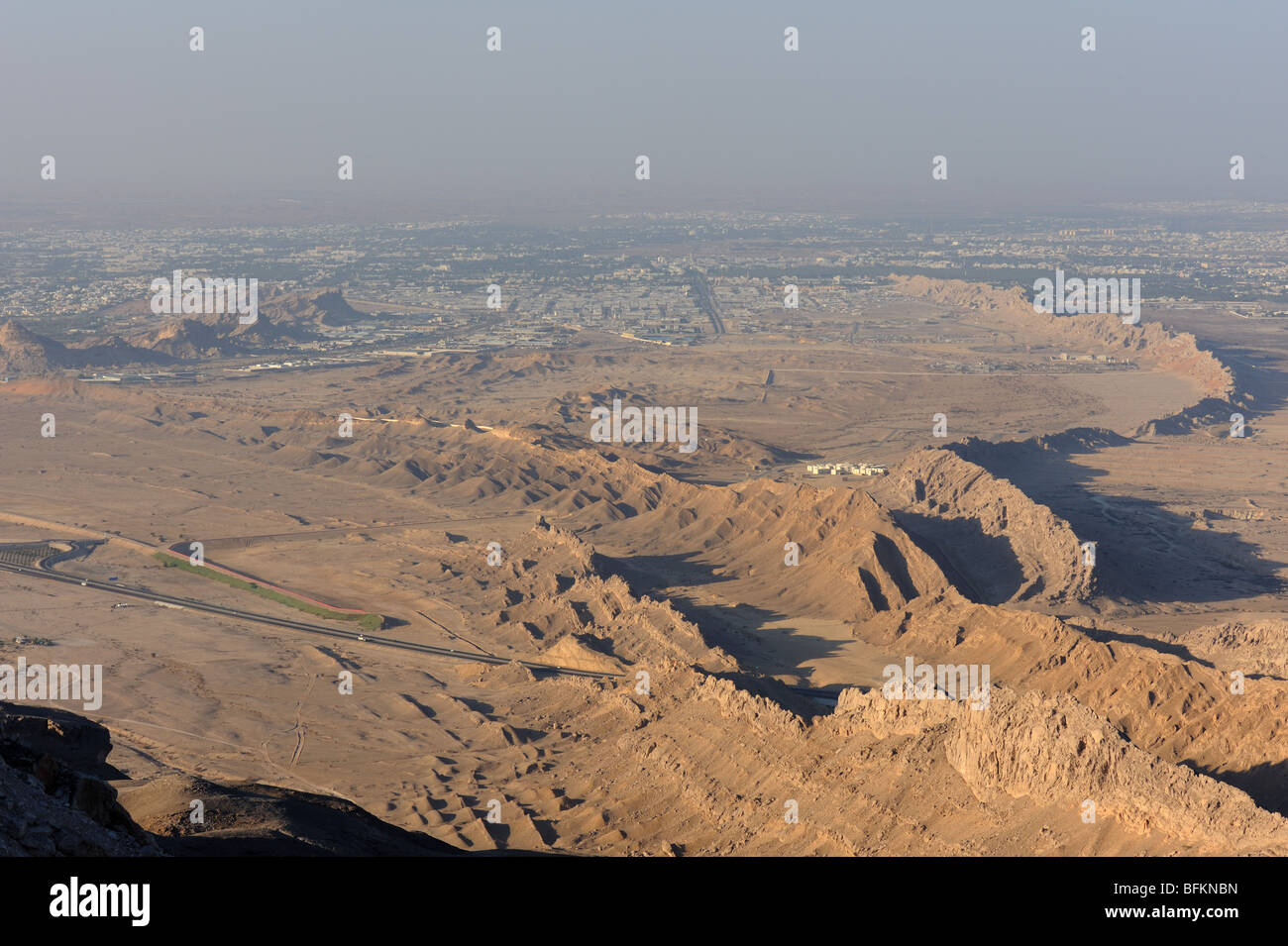 View from Jebel Hafeet mountain sand ridges in desert near Al Ain oasis, UAE Stock Photo