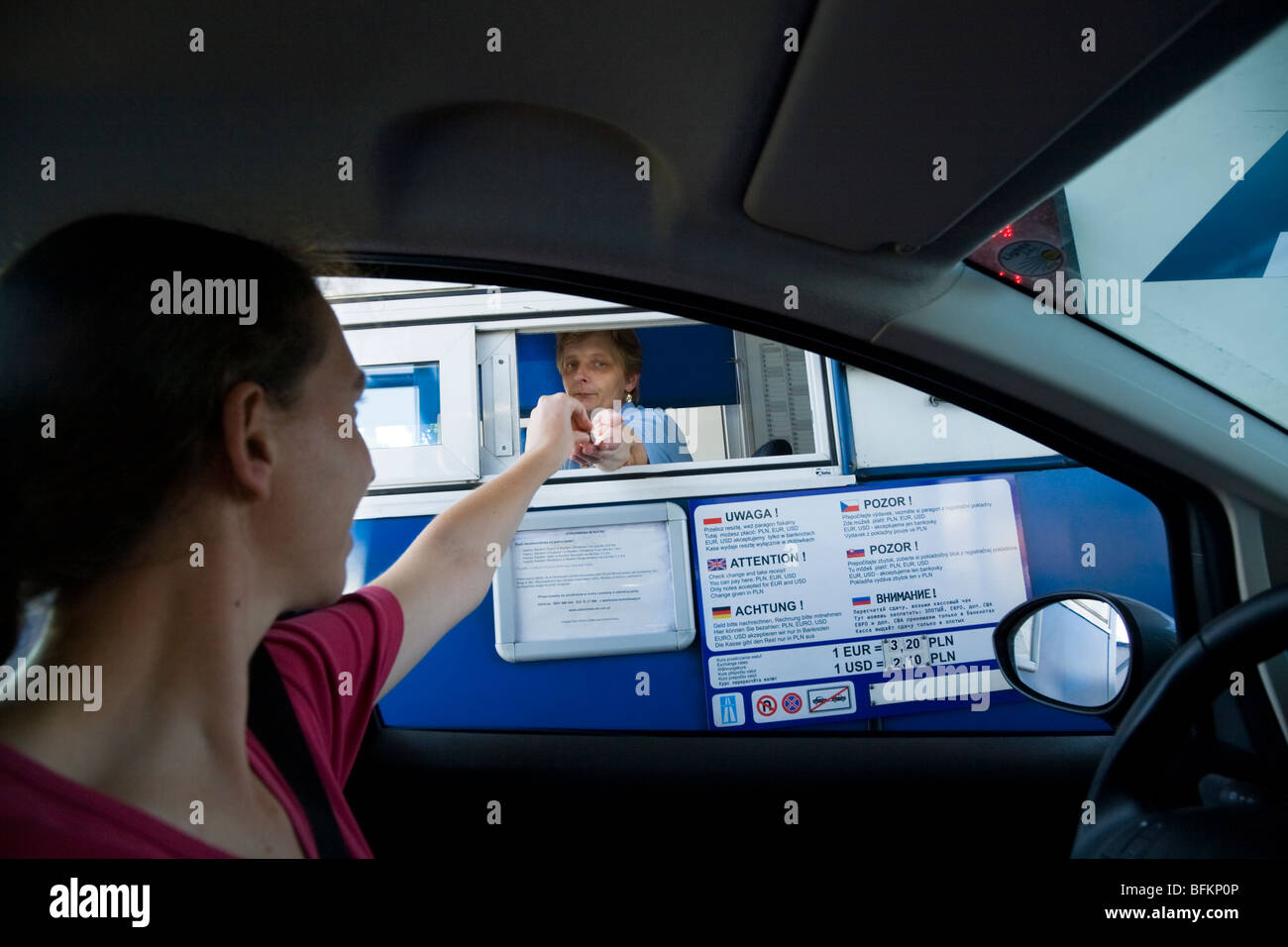 Tourist driver pays a road toll at a Polish motorway toll booth. Near  Krakow, Poland Stock Photo - Alamy