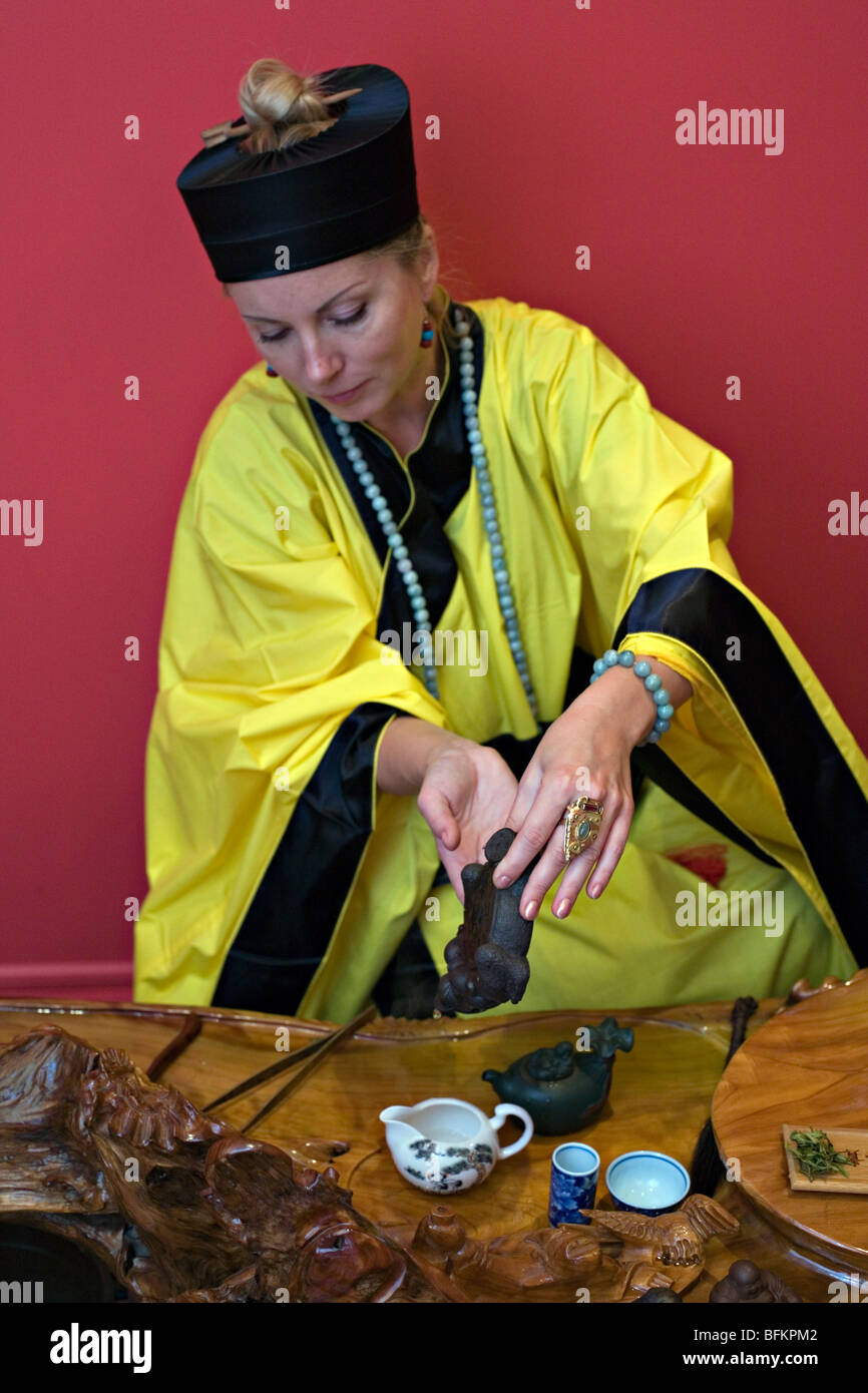 Caucasian woman performing Chine's tea ceremony Stock Photo
