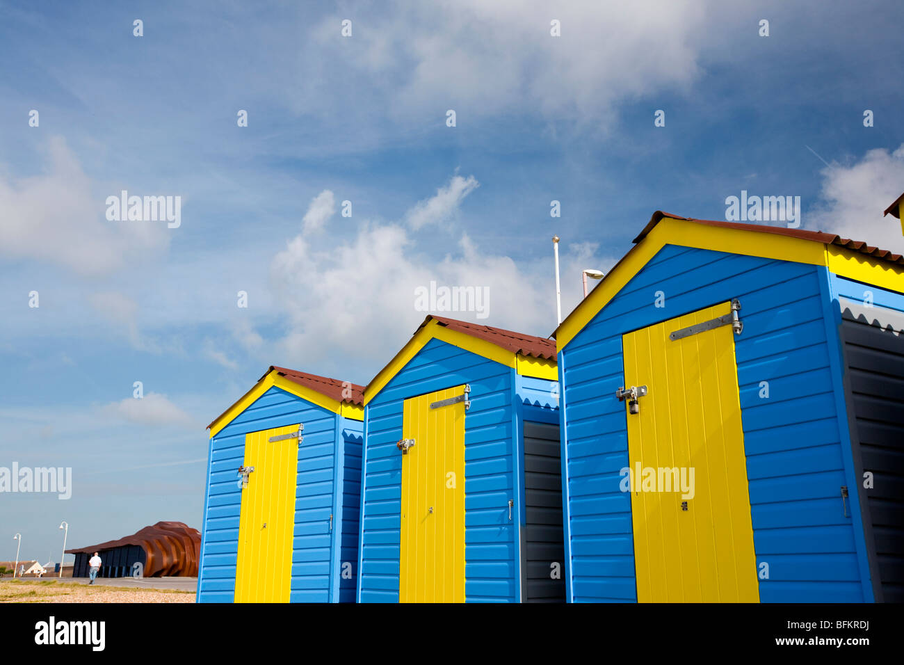 Blue yellow beach huts on the seafront of East Beach Cafe, Littlehampton, West Sussex, England, Britain Stock Photo