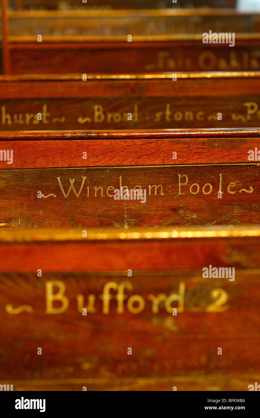 The names of houses in the parish on the C18th pews showing where to sit in Shermanbury parish church Henfield, West Sussex, UK Stock Photo