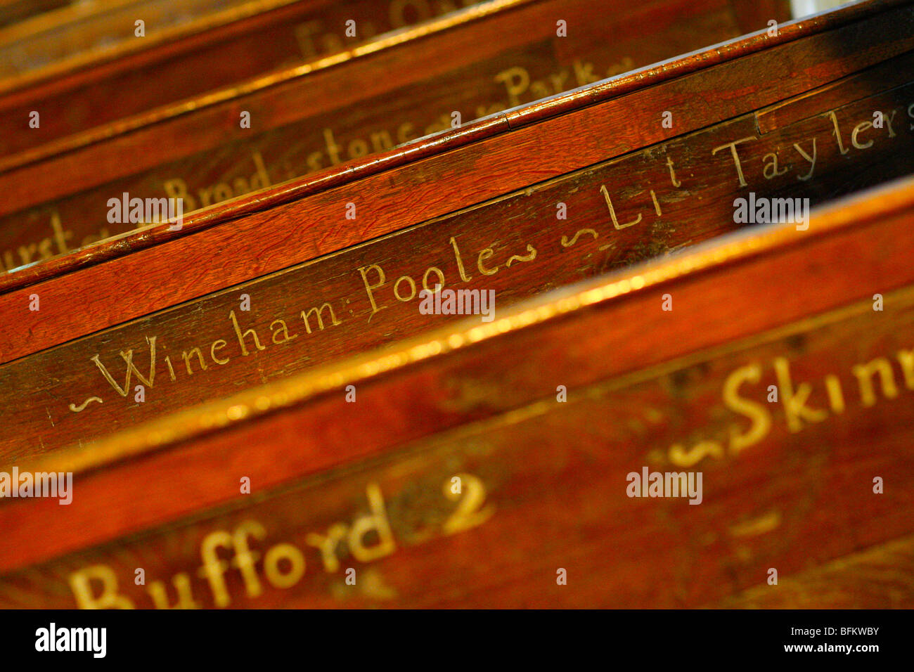 The names of houses in the parish on the C18th pews showing where to sit in Shermanbury parish church Henfield, West Sussex, UK Stock Photo