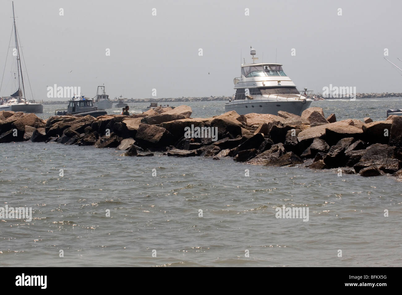Boats seen behind breakwater in annual blessing of the fleet in Galilee