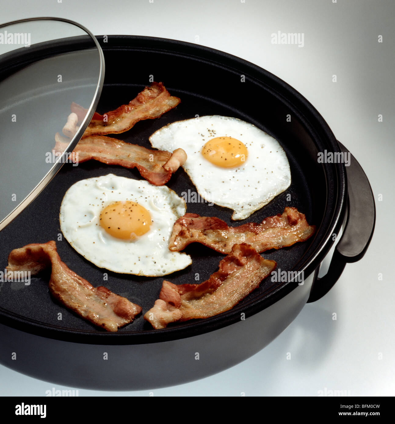 Bacon and eggs in a crock pot Stock Photo Alamy