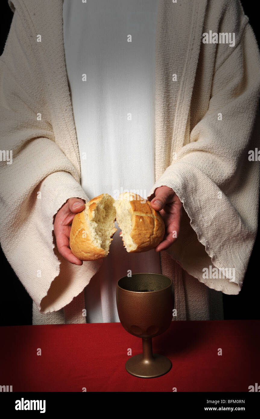Jesus breaking bread as a symbol of Communion Stock Photo