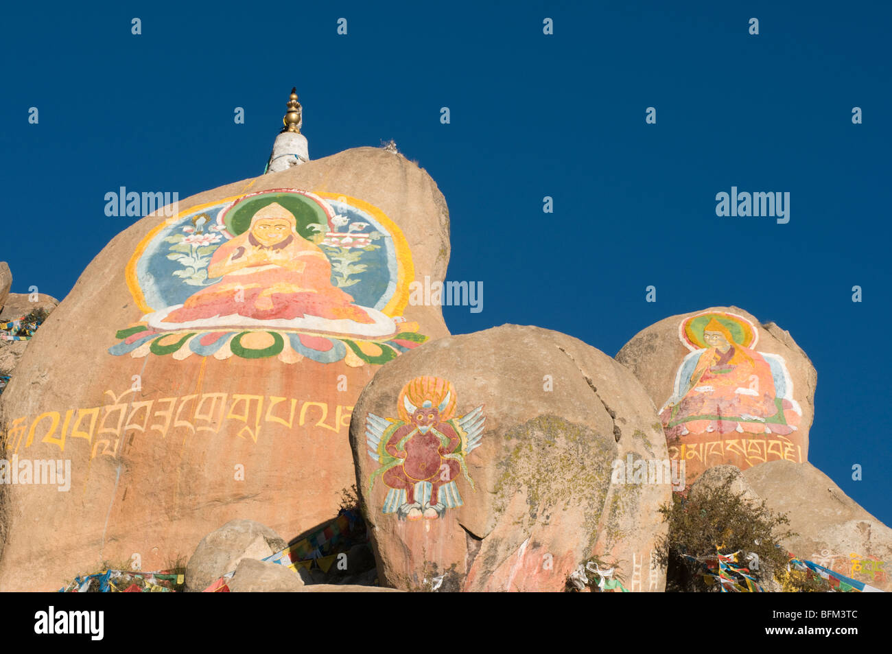 Buddhist rock paintings and carvings a the famous Drepung monastery in Lhasa Tibet Stock Photo