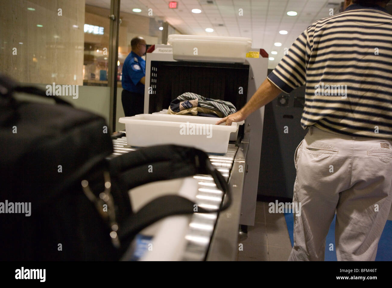 Security check at airport, baggage, purse, shoes, xray machine Stock Photo