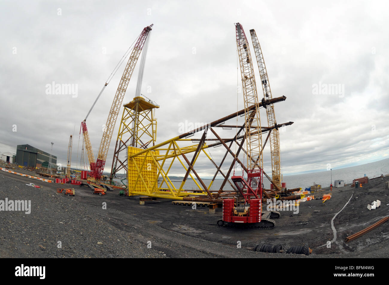 Sub sea supports for off shore wind turbines being built. Stock Photo
