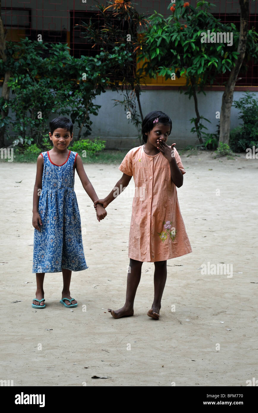 Small children in the grounds of a Children's Home: The All Bengal Woman's Welfare Union, Kolkata (Calcutta) West Bengal, India Stock Photo