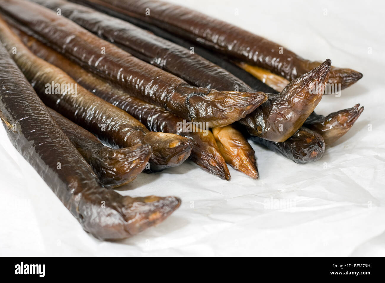 Two pounds of smoked eel on white paper Stock Photo Alamy