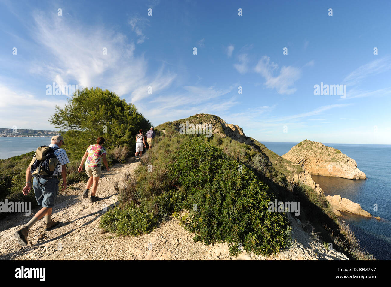 walkers on Cap Prim headland, Javea / Xabia, Alicante Province, Comunidad Valenciana, Spain Stock Photo