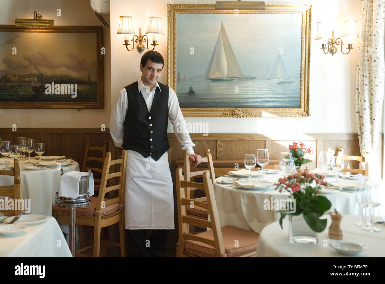 Waiter inside Poissonnerie de l'Avenue , 82 Sloane Avenue, London Stock Photo