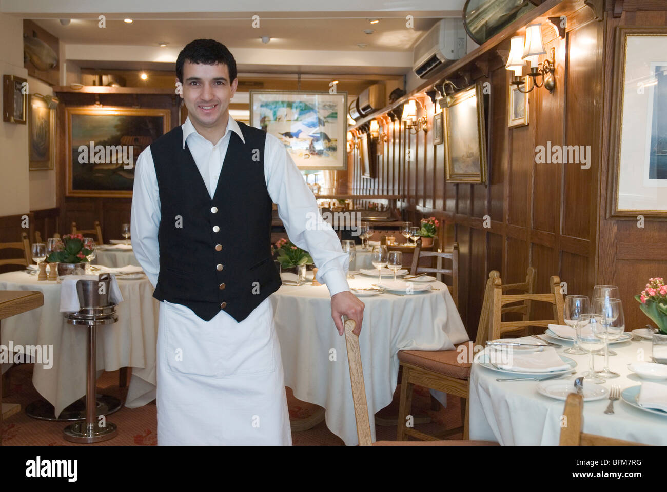 Waiter inside Poissonnerie de l'Avenue , 82 Sloane Avenue, London Stock Photo