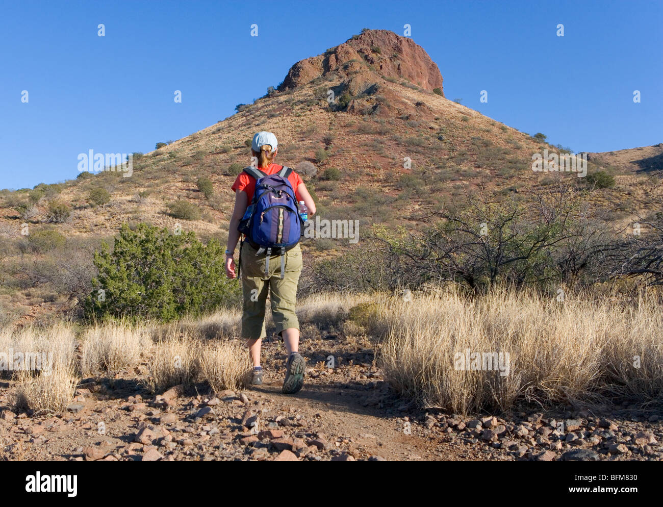 A woman hiking the Vista Trail at the Muleshoe Ranch Stock Photo