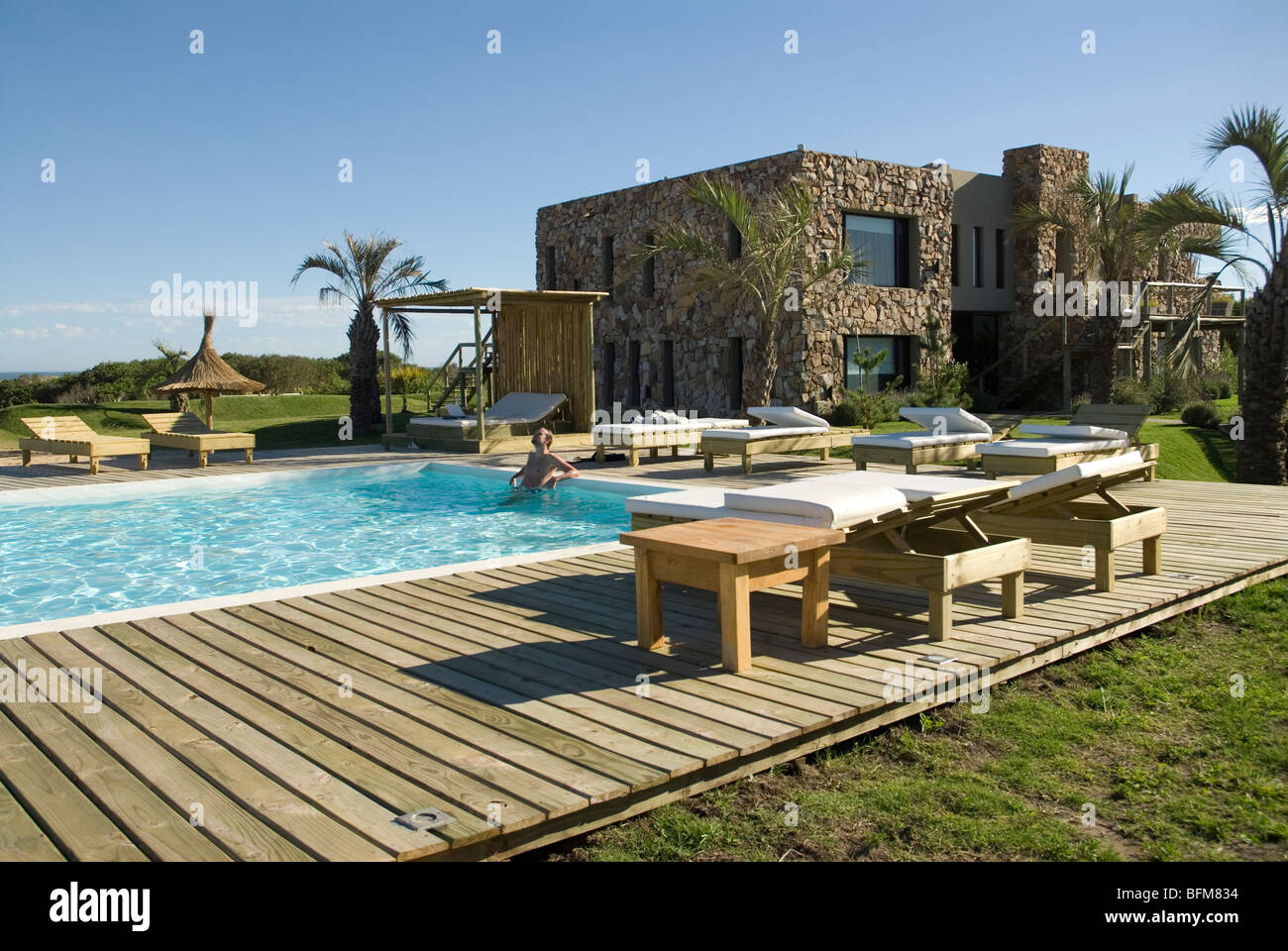 Man in pool at Casa Suaya, Jose Ignacio, Uruguay Stock Photo Alamy