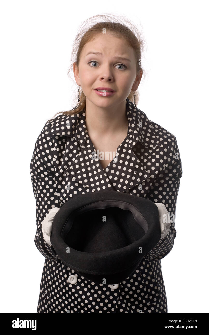 young woman with mournful face and hat in hands isolated on white Stock ...