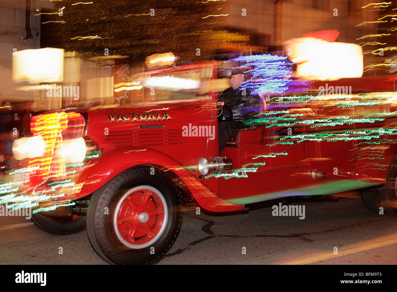 Vintage firetruck in 2009 Victoria Santa Claus parade through downtown
