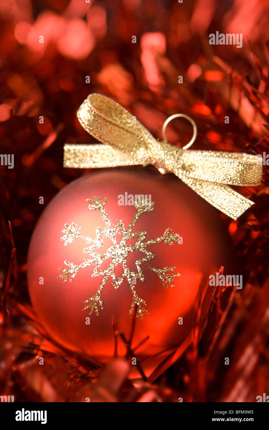 Red christmas ball with gold bowl. aRGB. Stock Photo