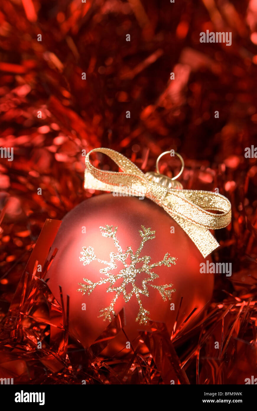 Red christmas ball with gold bowl. aRGB. Stock Photo