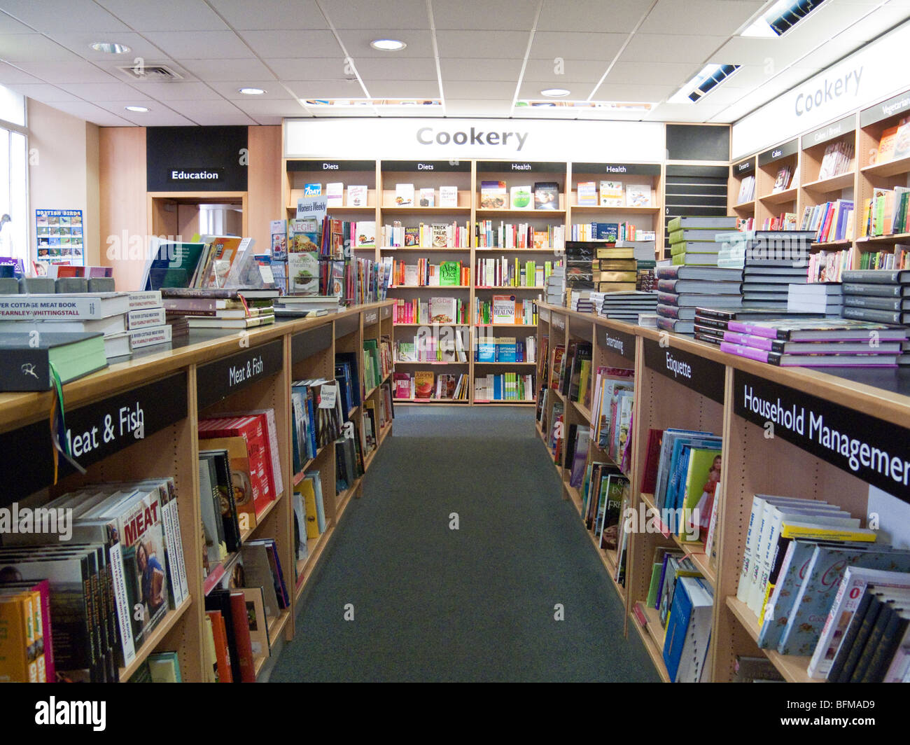 cookery books on shelves, Foyles bookshop, London, England, UK Stock Photo