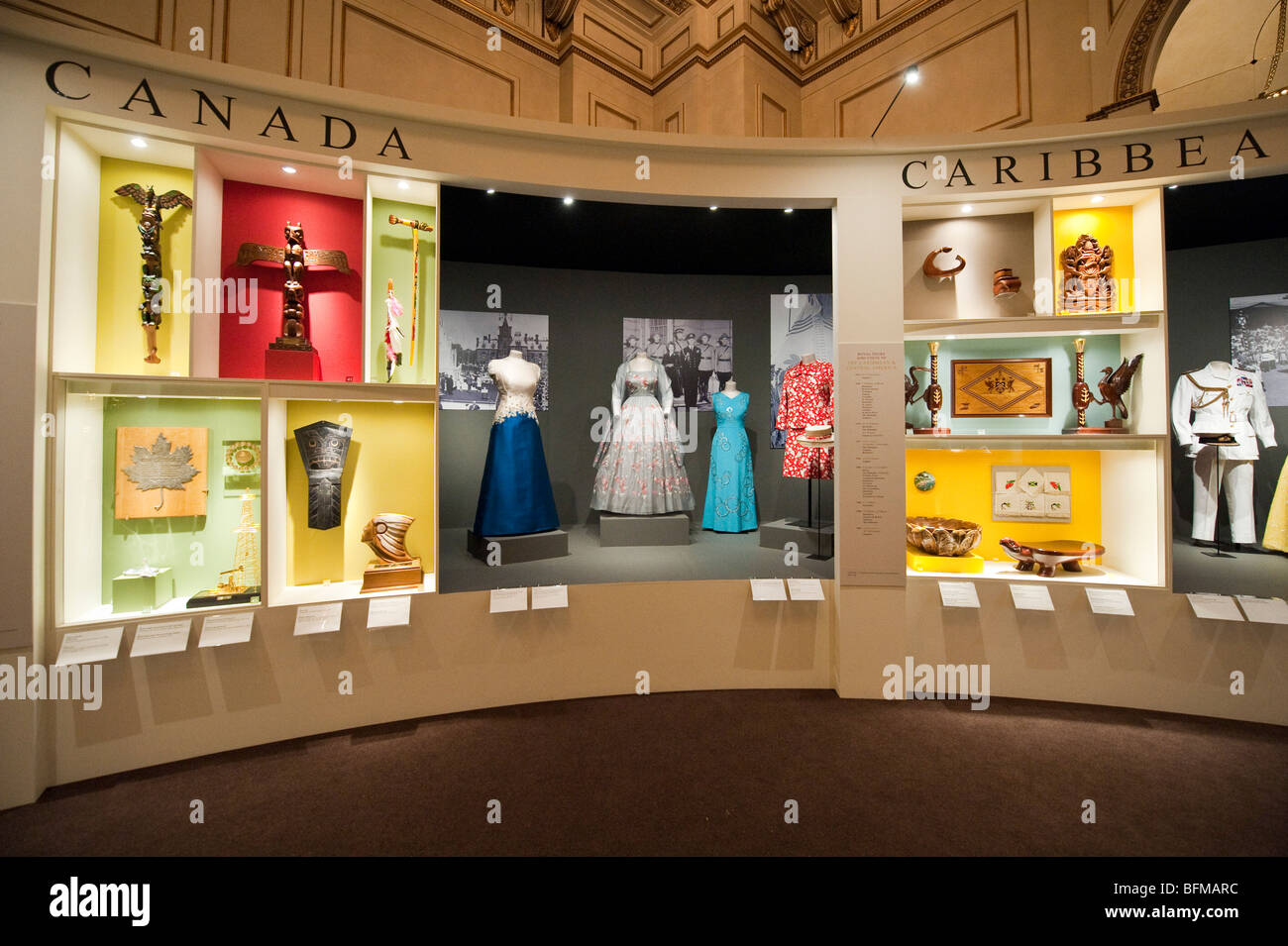 Dresses worn by Queen Elizabeth II on display at the 'Queen and Commonwealth The Royal Tour' exhibition at Buckingham Palace Stock Photo