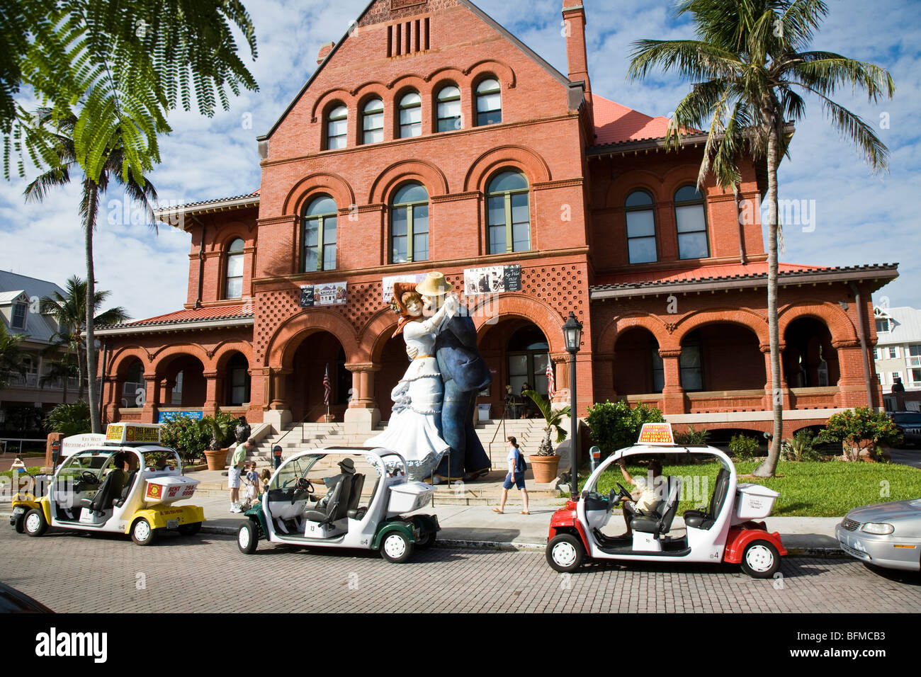 Electric rental carts queue for cruise passengers in front the elegant