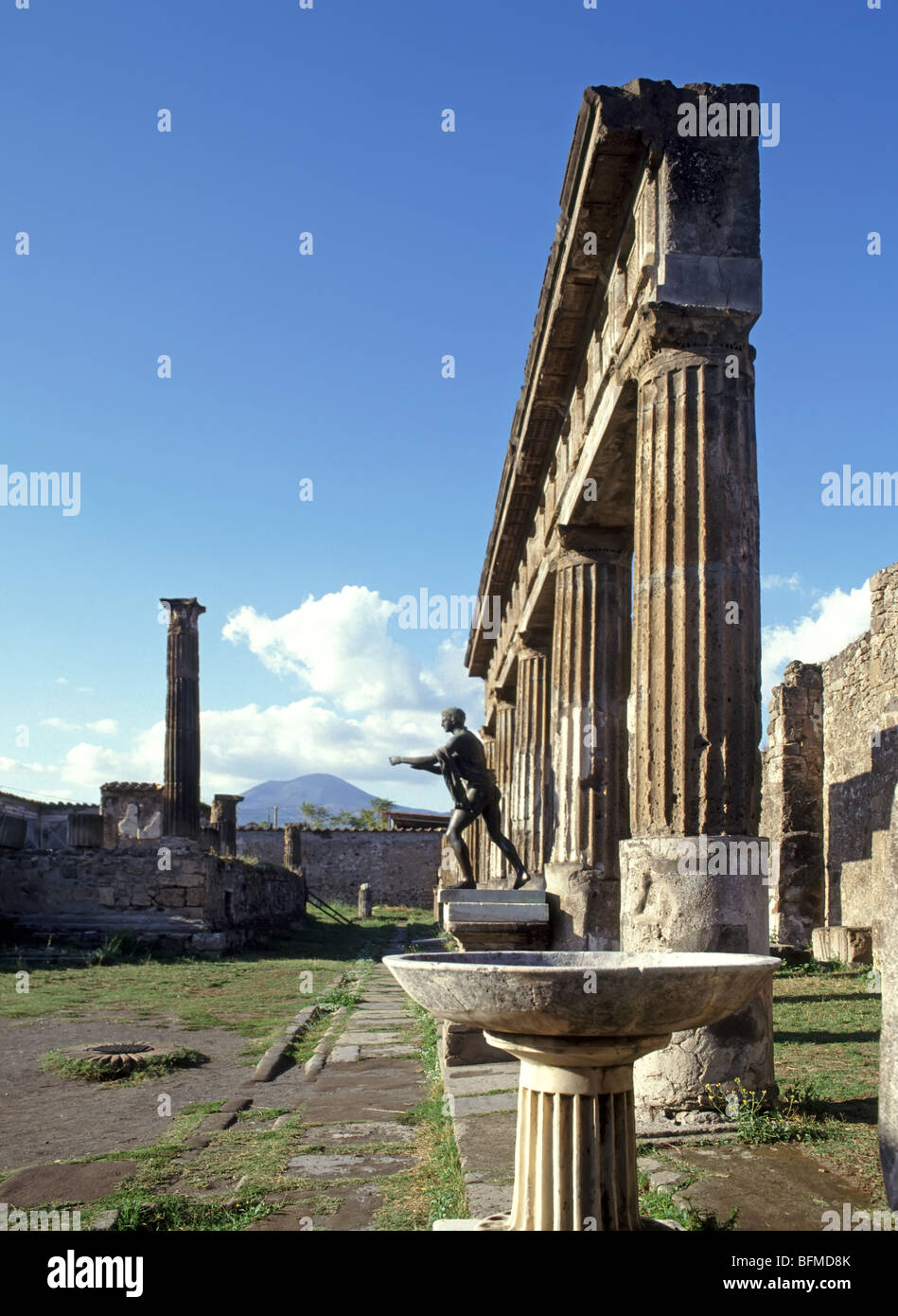 Pompeii statue of Apollo beside temple ruins Stock Photo