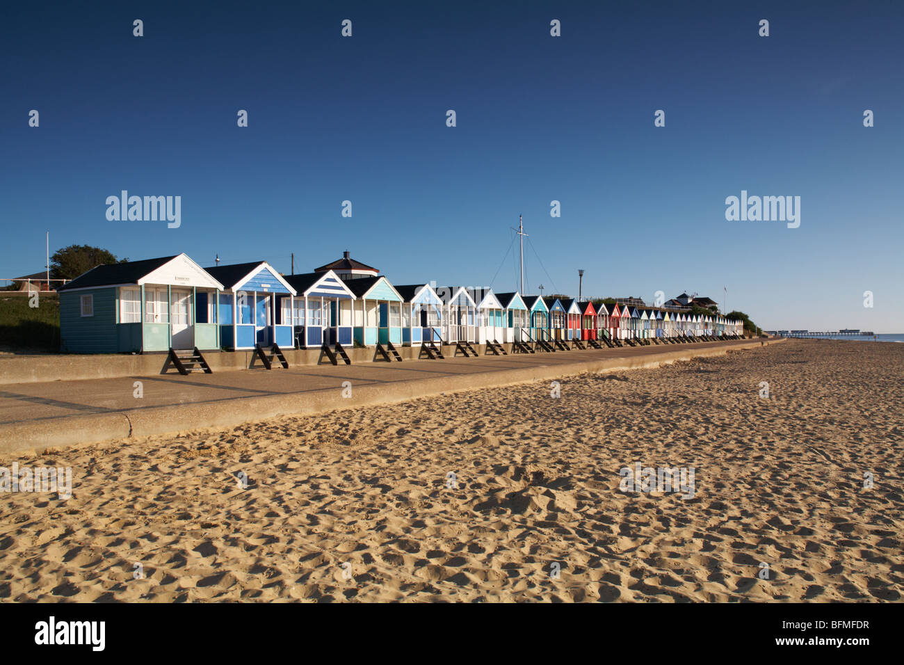 Great Britain England East Anglia  Suffolk Southwold Beach Huts stretching along promenade Stock Photo