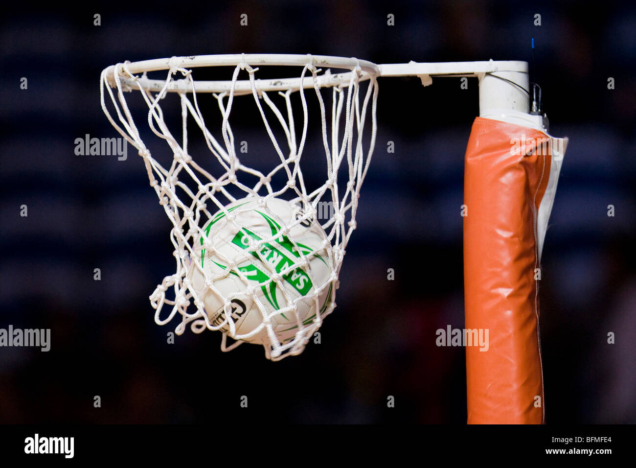 Netball in hoop Stock Photo