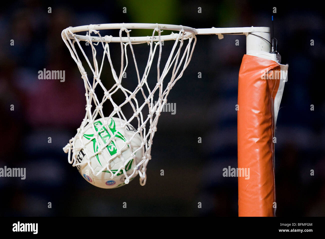 Netball in hoop Stock Photo