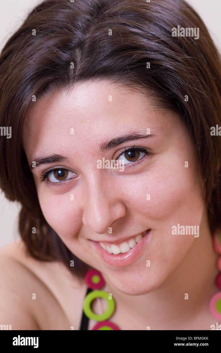 Happy young woman smiling Stock Photo - Alamy