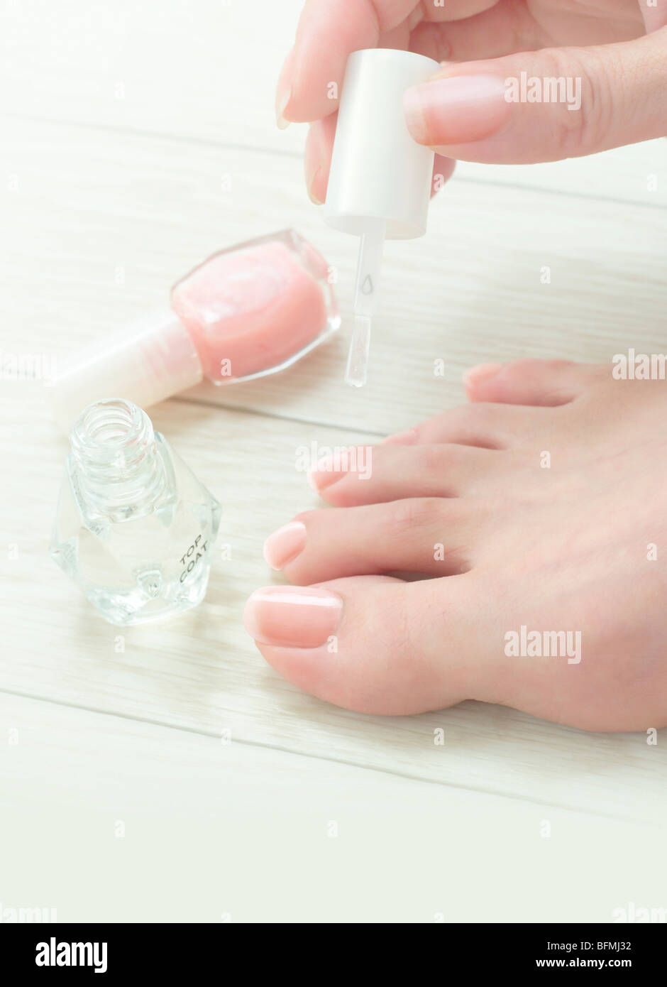 Woman painting toenails Stock Photo Alamy