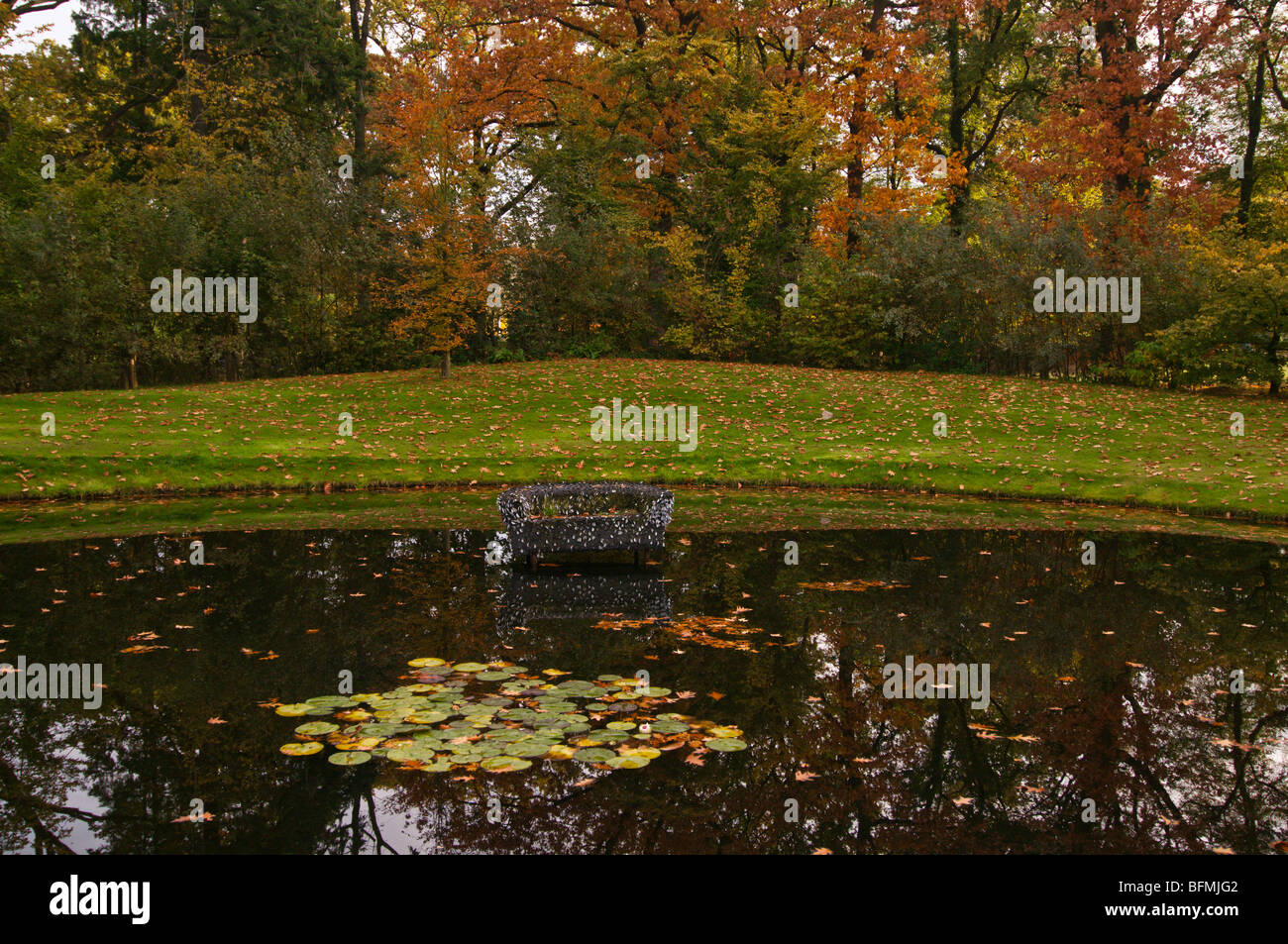 Holland,North Rhine,Kasteeltuinen Arcen, pond with a sofa Stock Photo