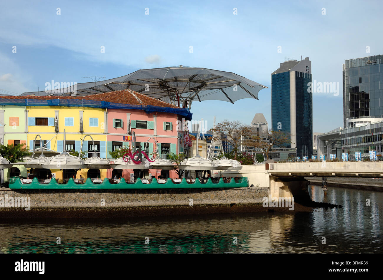 City View of Riverside Bars and Restaurants on Clarke Quay with Singapore River & Skyline of Financial District, Singapore Stock Photo