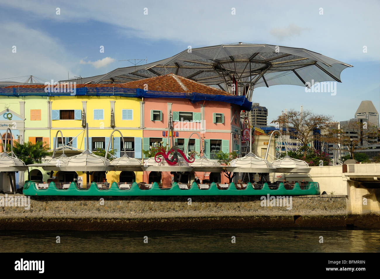 Pastel Coloured Riverside Restaurants & Bars in Restored Colonial Shophouses on Clarke Quay, Singapore River, Singapore Stock Photo