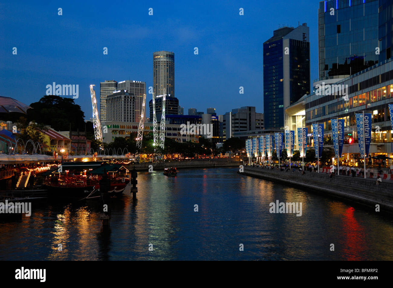 Townscape, Cityscape, and Skyline of Clarke Quay, Boat Quay and Singapore River at Dusk or Night, Singapore Stock Photo