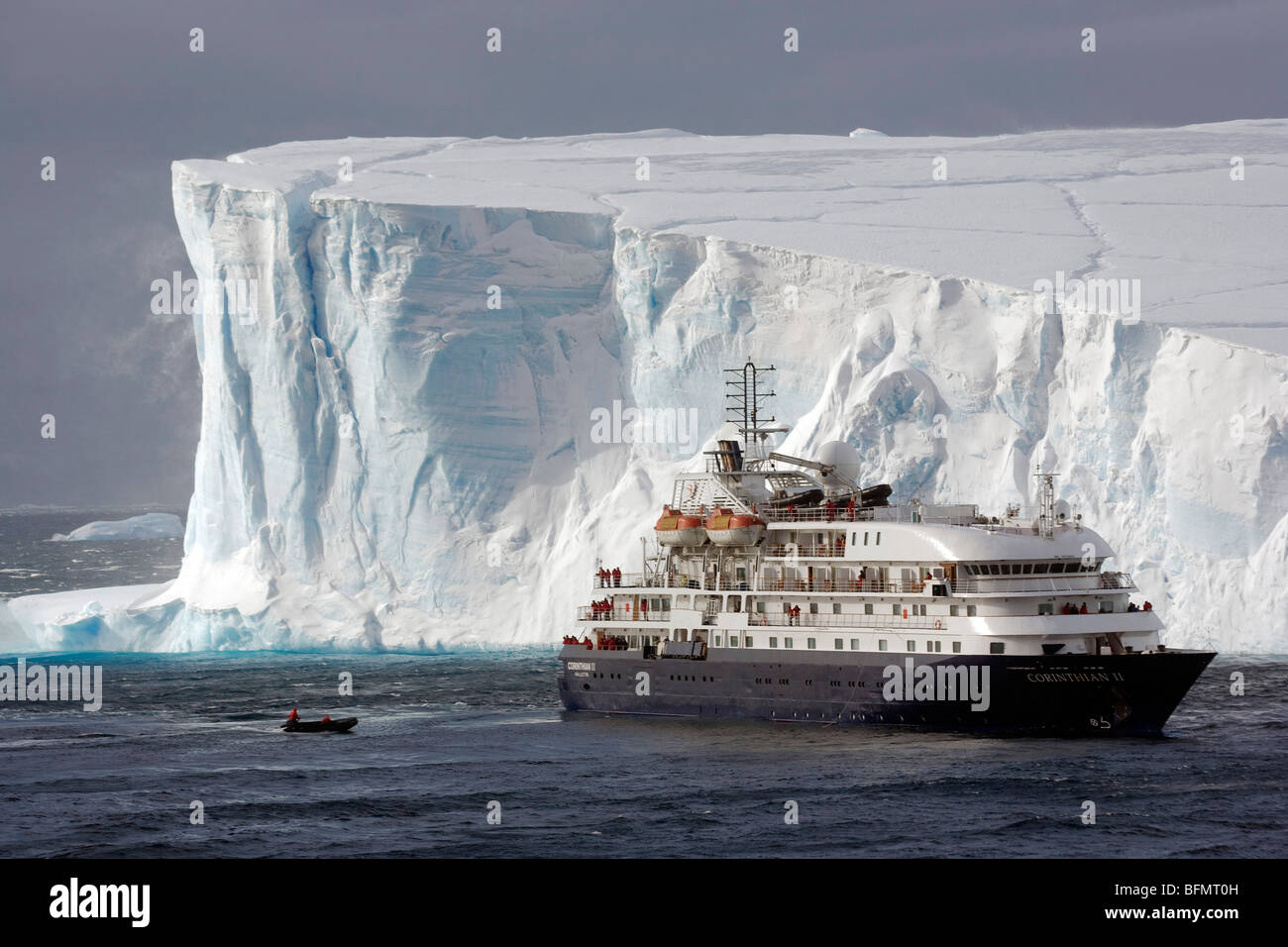 Antarctica, Antarctic Sound and Hope Bay, expedition ship the Corinthian III is dwarfed by the tabular icebergs. Stock Photo