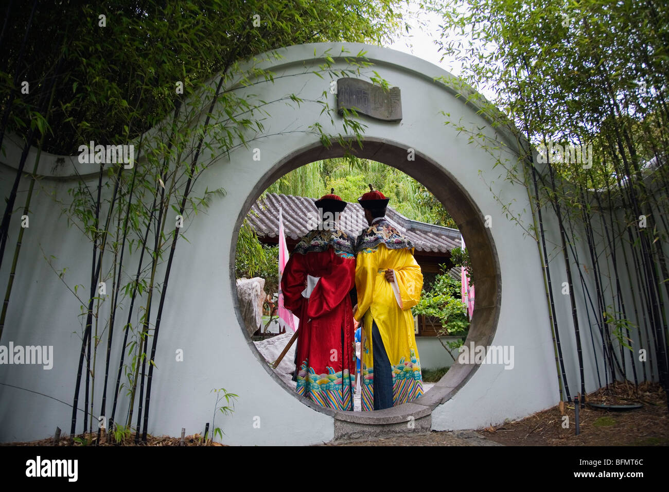Australia, New South Wales, Sydney.  Visitors in costume dress at the Chinese Garden of Friendship in Darling Harbour. Stock Photo