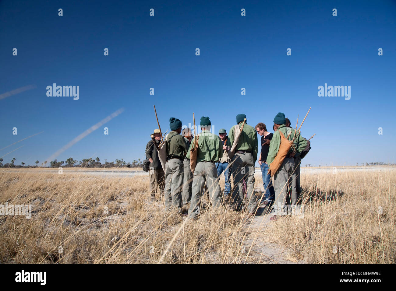 Botswana, Makgadikgadi, Jack's Camp. Bushmen guides teach tourists about their surroundings. Stock Photo