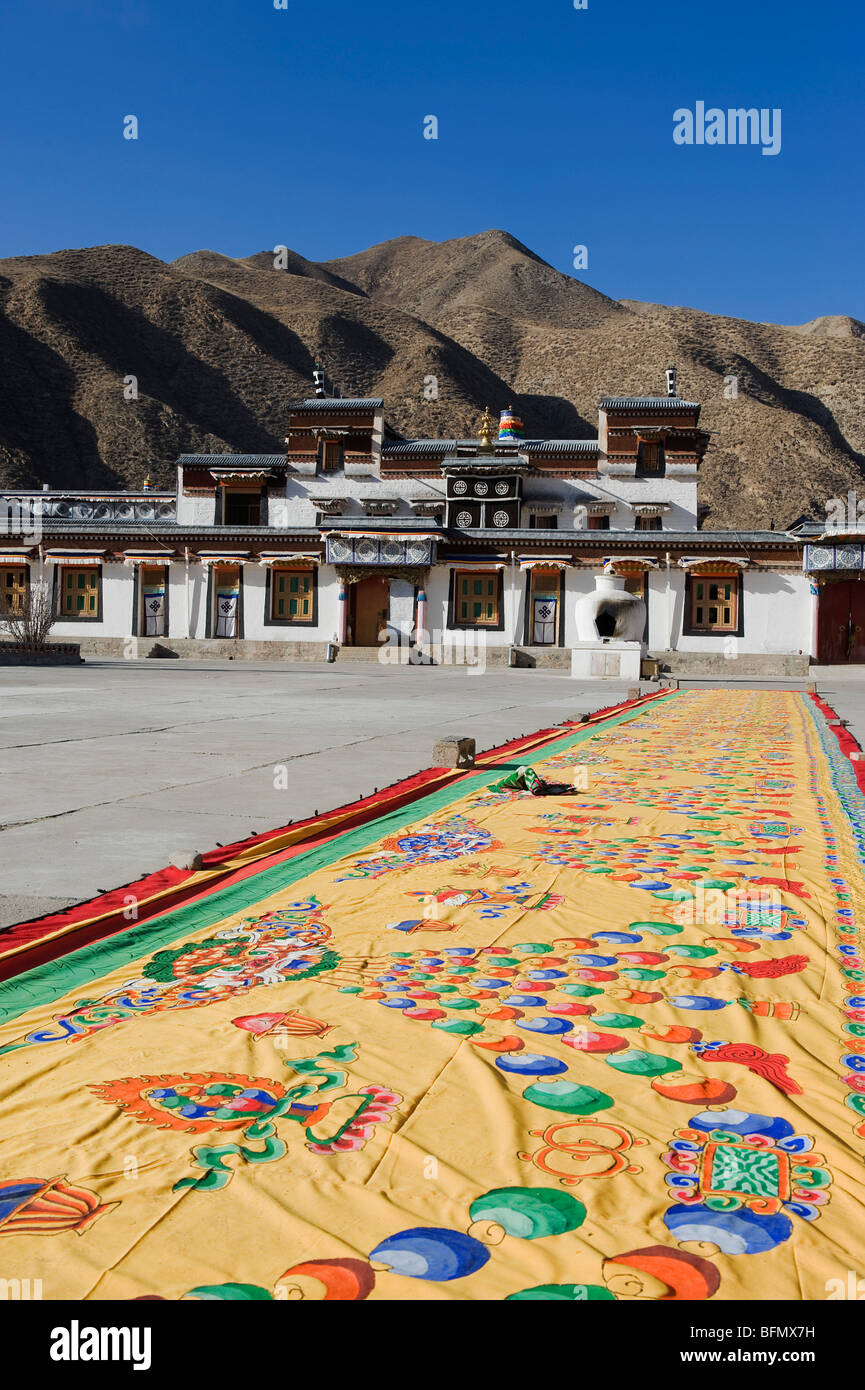 China, Gansu Province, Xiahe, Labrang Monastery (1709), Thangka painting drying in the sun Stock Photo
