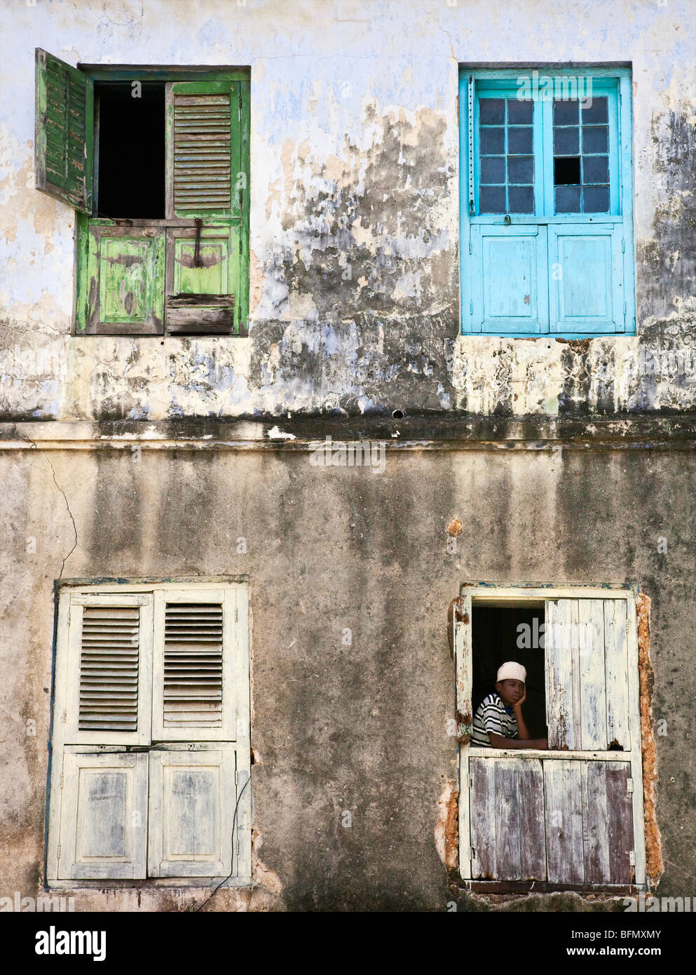 Tanzania, Zanzibar, Stone Town. The shuttered windows of an old building in Stone Town. Stock Photo