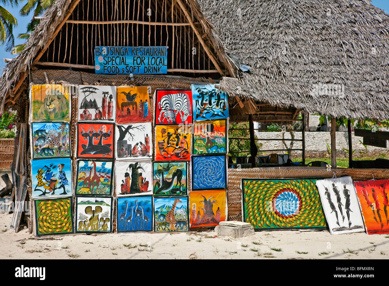 Tanzania, Zanzibar. A restaurant selling paintings by local artists near Paje Beach in the southeast of the island. Stock Photo