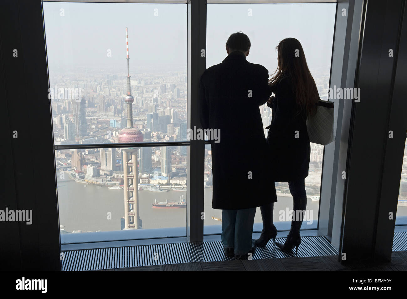 China, Shanghai, Pudong new area, a couple looking at the view from the International Finance Tower Stock Photo